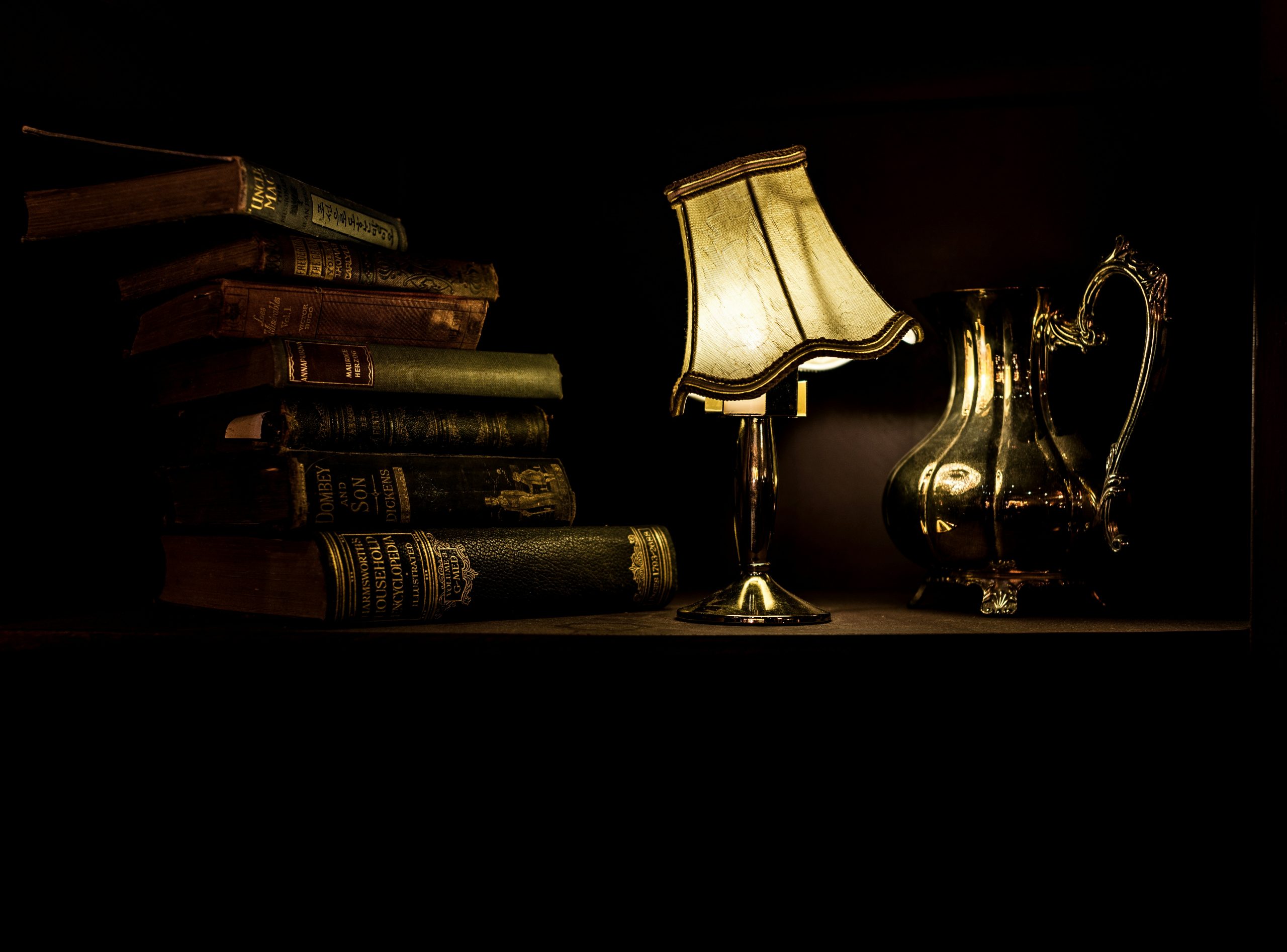 Books and lamp on a table